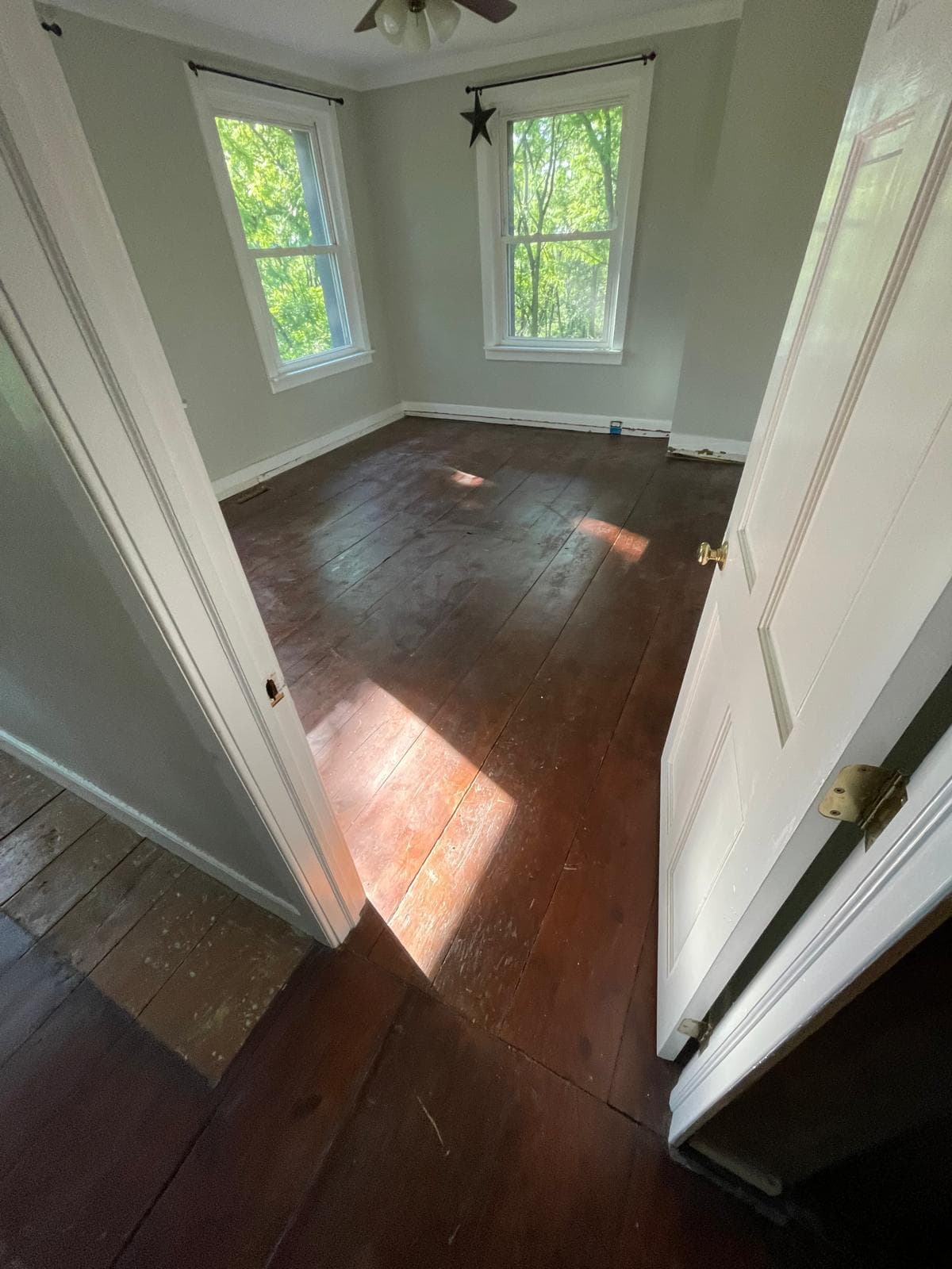 Scratched and damaged hardwood floor before repair in Randolph NJ