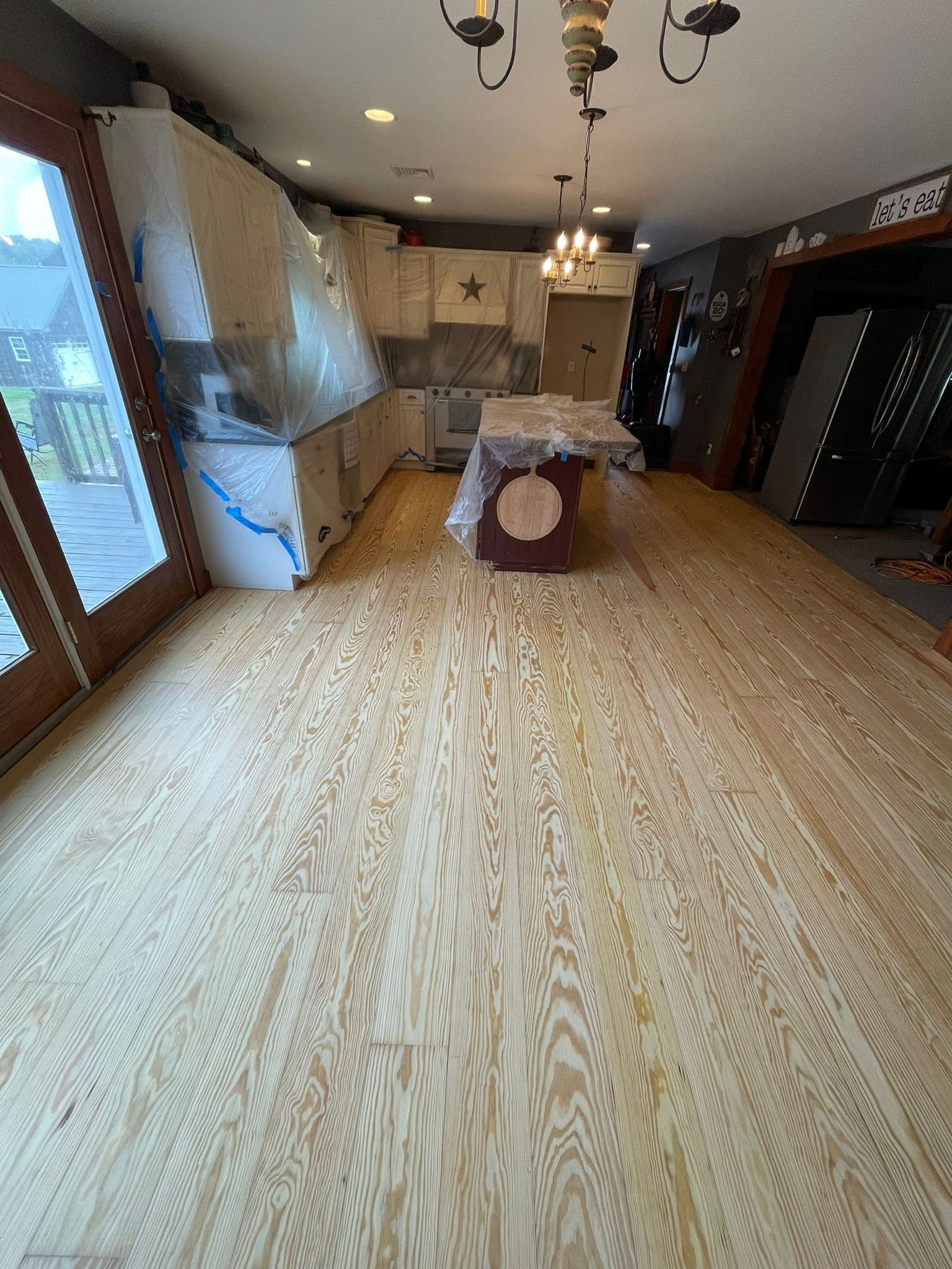 Golden Pine team using dustless hardwood floor sanding equipment in a New Jersey home