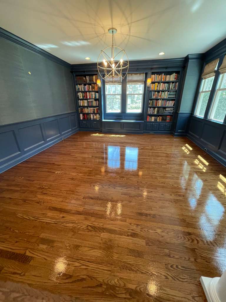 Beautiful refinished hardwood oak floor in a New Jersey home living room with natural light